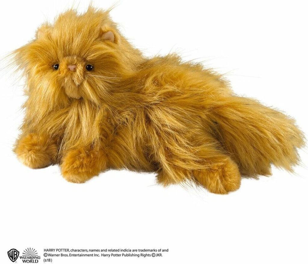 A plush toy cat lying down on a white background.