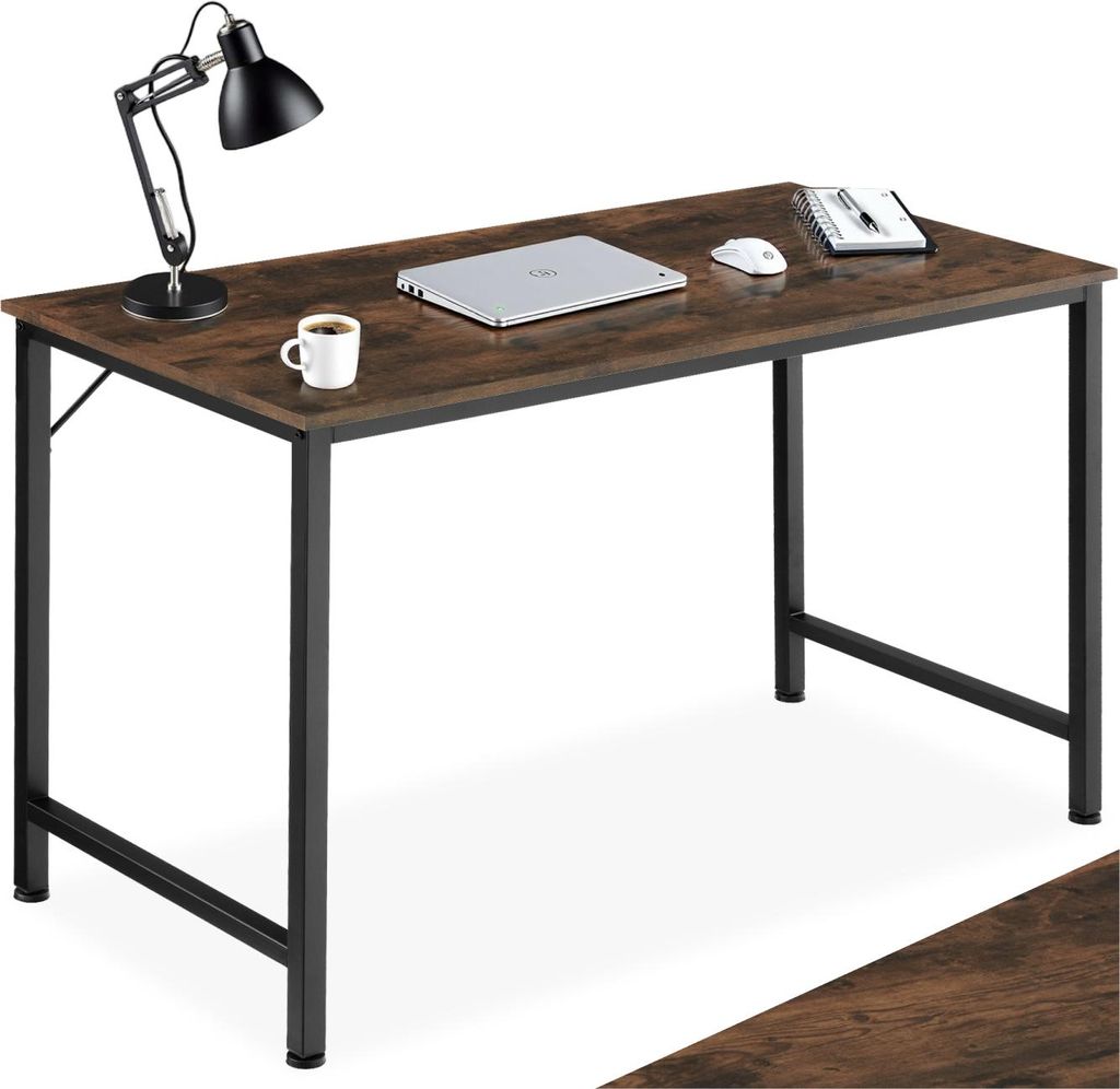 A desk with a laptop, mouse, notebook, and coffee cup on it.