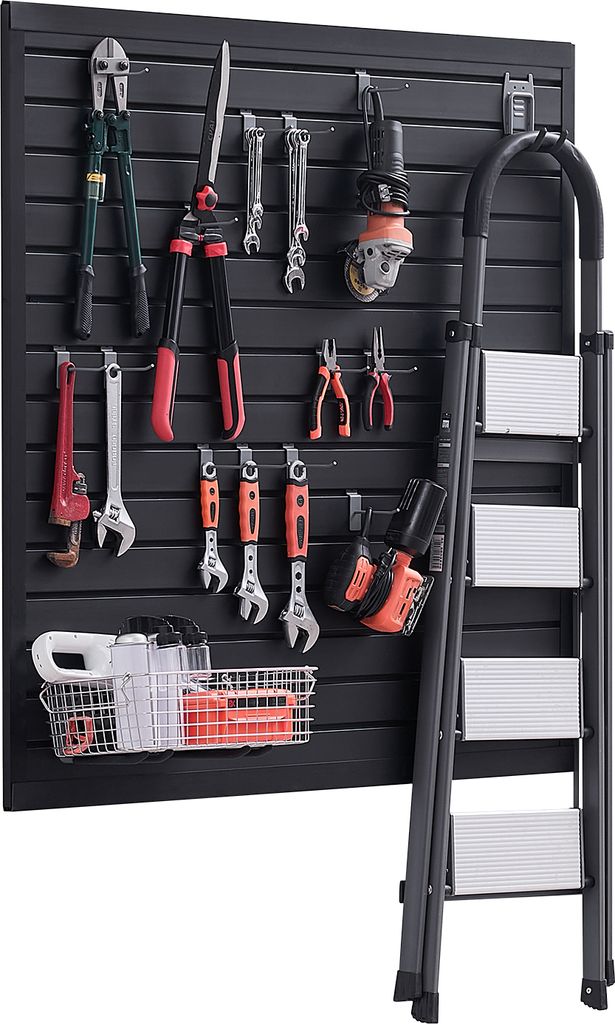A tool wall organizer with various tools mounted on it, including bolt cutters, pruning shears, wrenches, pliers, an angle grinder, a drill, and a step ladder leaning against it.