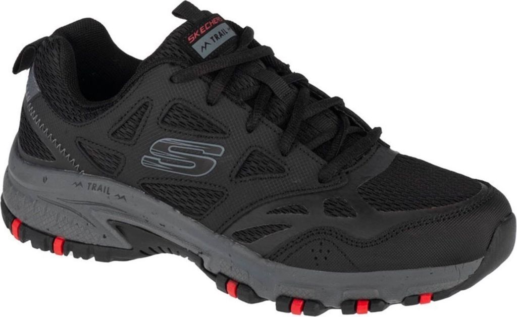 A single black Skechers Hillcrest sneaker is shown from a side angle against a white background.