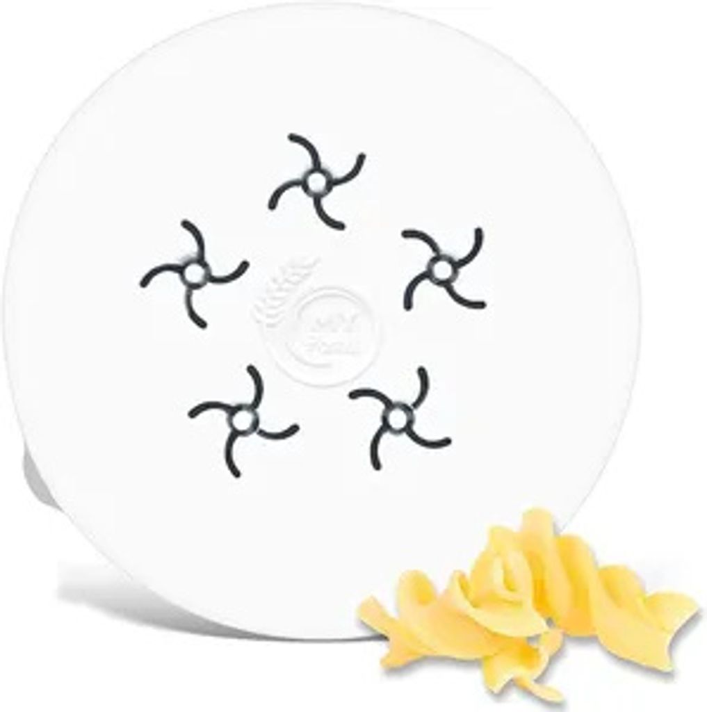 A white disc with five star-shaped cutouts and a pasta-making attachment with pasta. Several pieces of fusilli pasta are visible in the foreground.