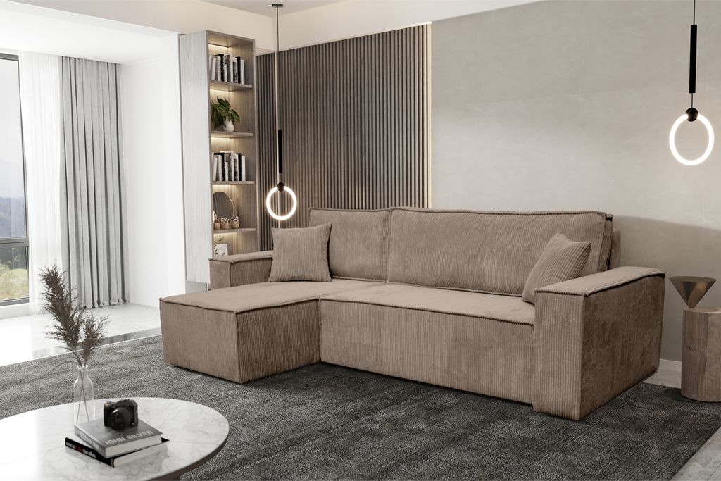 A modern living room with a sectional sofa, bookshelf, and coffee table.