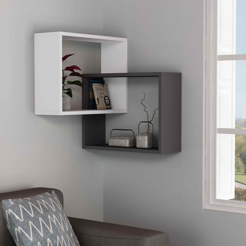 A modern living room corner with a white and gray wall-mounted shelf unit.