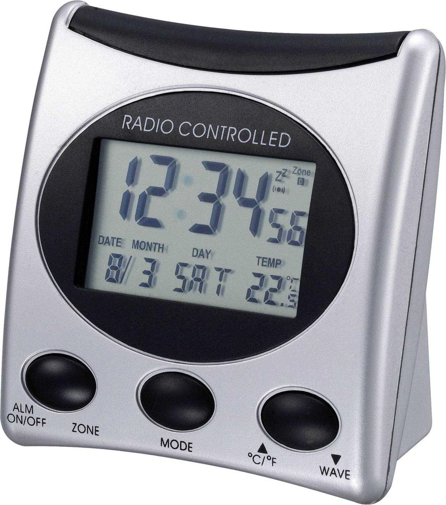 A digital alarm clock with a silver and black casing, displaying the time, date, and temperature.