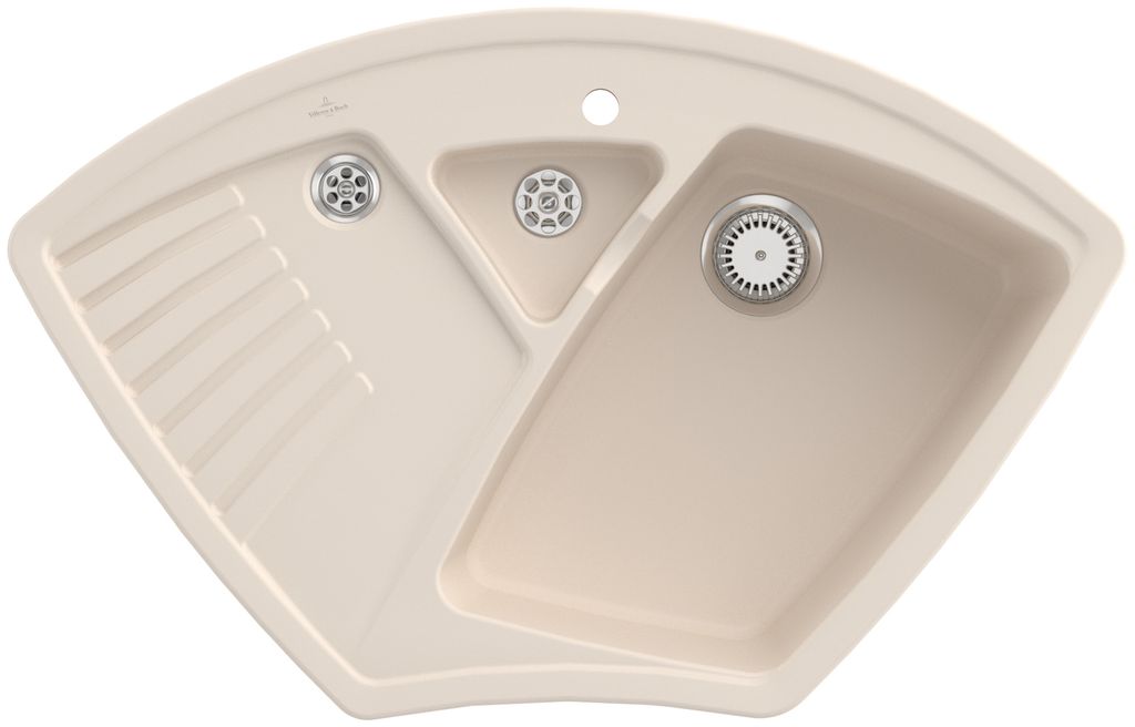 A top-down view of a beige corner sink with multiple basins and a drain.