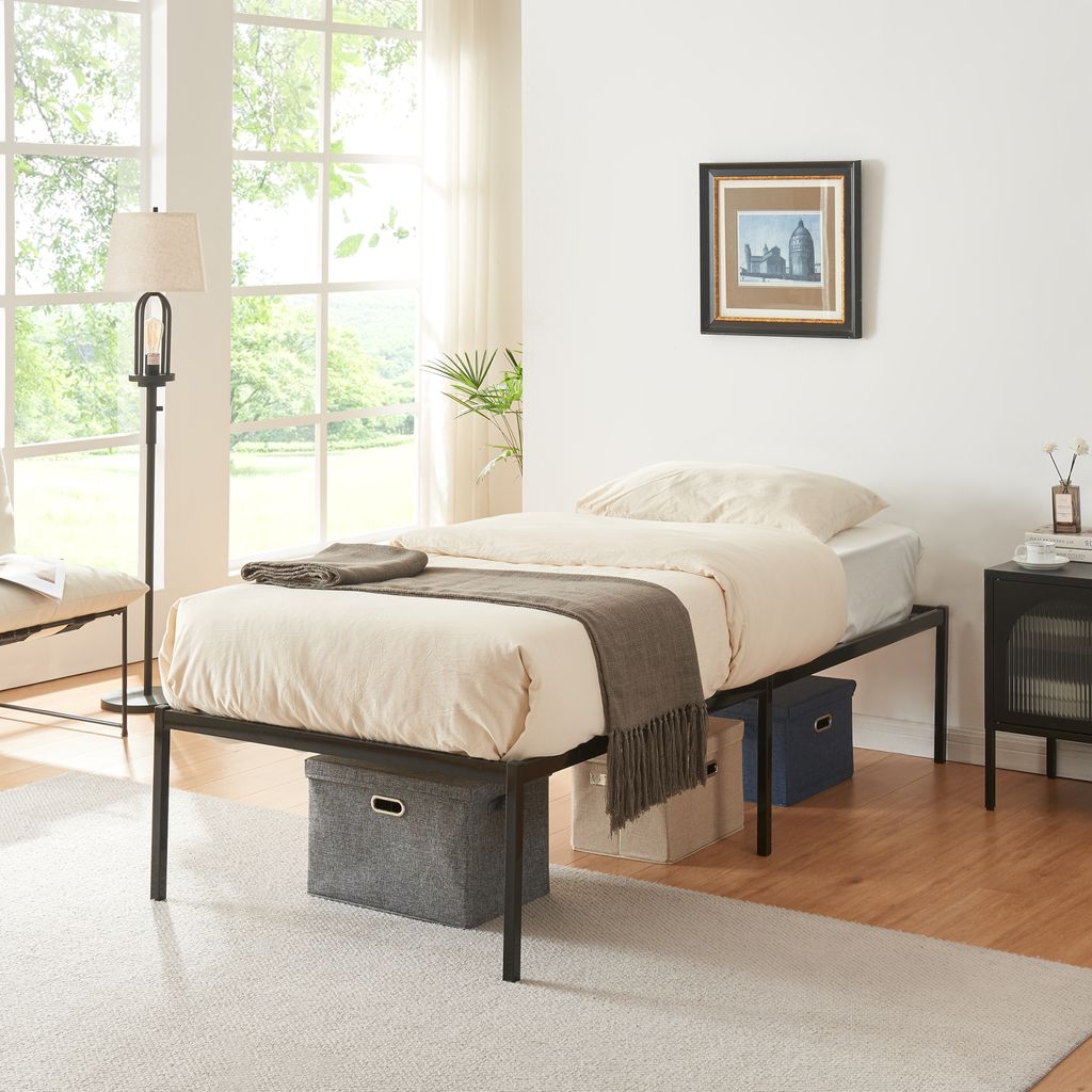 A bedroom scene with a bed, lamp, and nightstand.