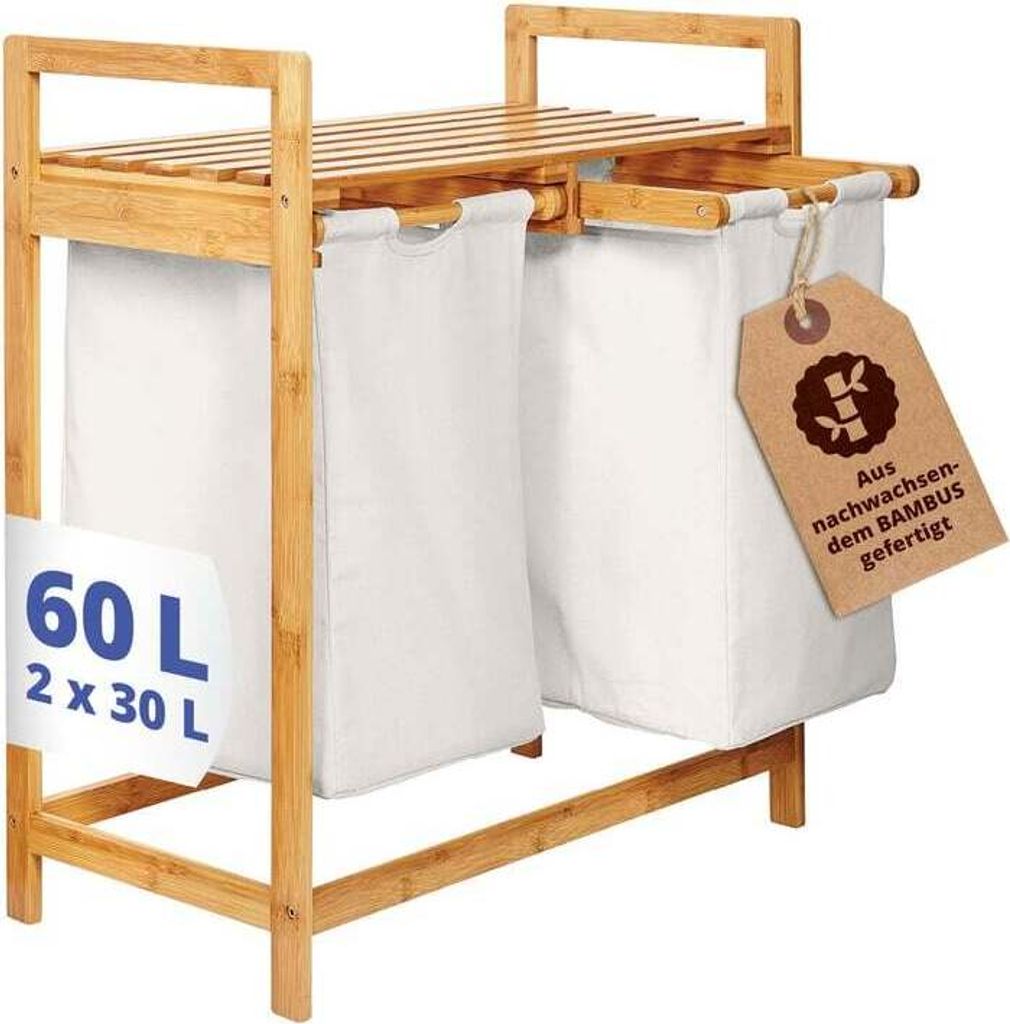 A bamboo laundry basket with two white fabric bags.