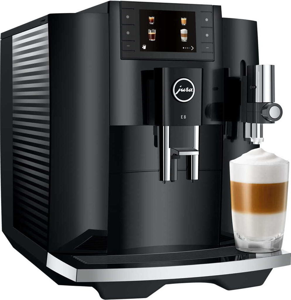 A black Jura E8 coffee machine with a glass of latte macchiato in the foreground.