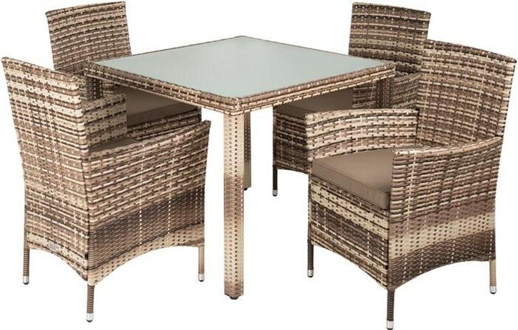 A polyrattan dining set with a glass-topped table and four chairs, presented on a white background.