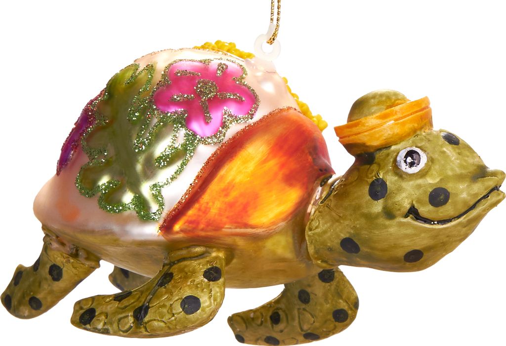 A close-up studio shot of a decorative glass turtle ornament.