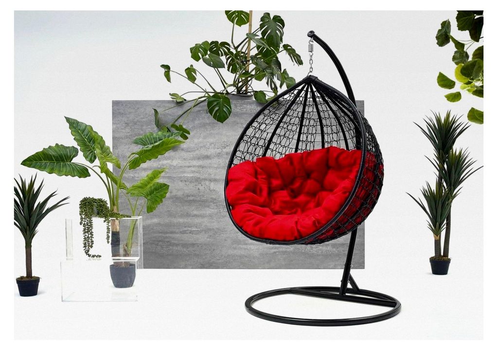 Hängesessel aus Polyrattan mit Gestell und roten Kissen für den Außenbereich
