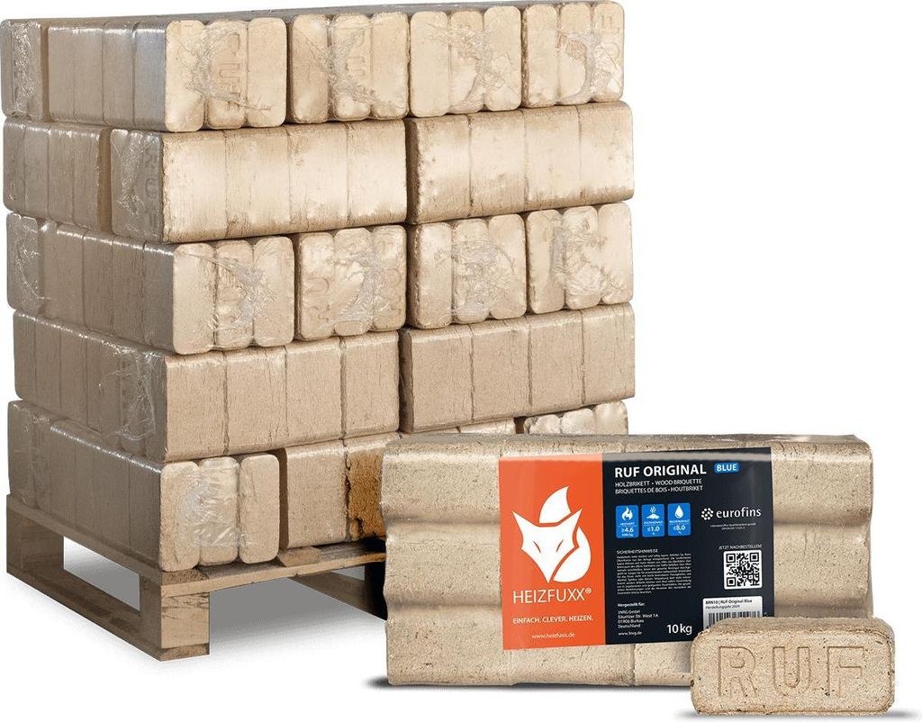 A pallet of compressed wood briquettes for fuel, with a close-up of a package in the foreground.