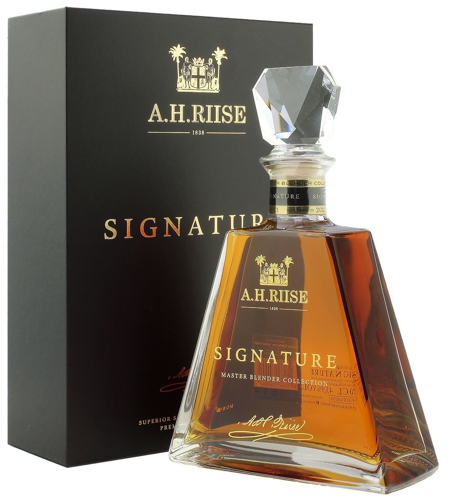 A bottle of A.H. Riise Signature rum and its presentation box.