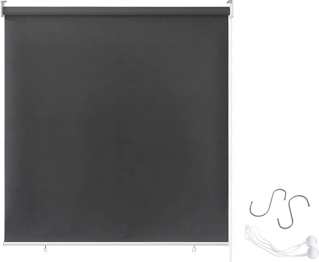 A dark grey roller blind is shown against a white background, with some accessories on the right side.