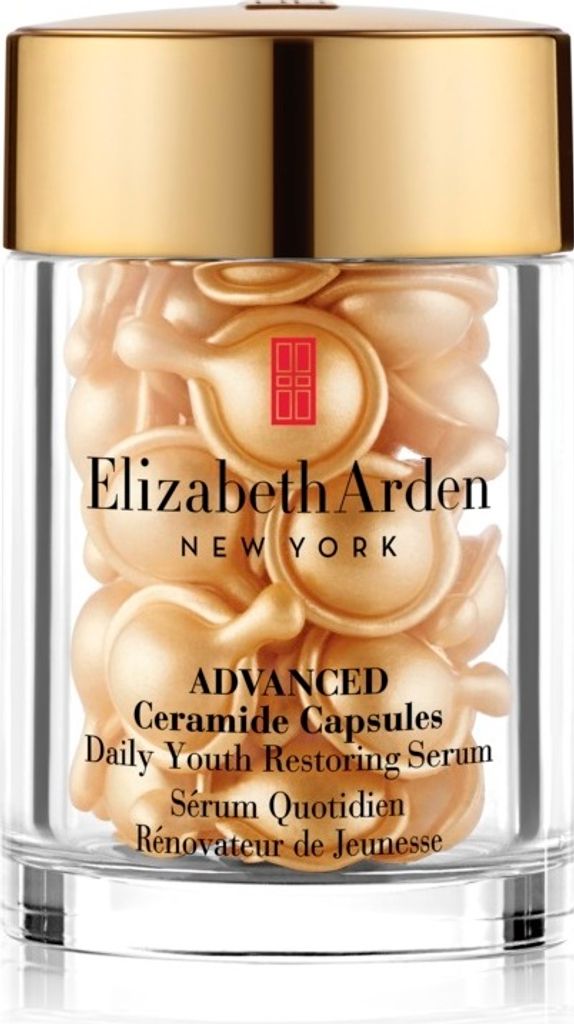A jar filled with small, pearl-like capsules of Elizabeth Arden serum.