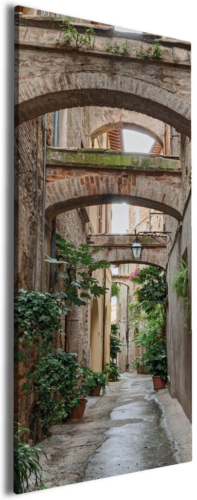 Wallario Premium Leinwandbild Grüne italienische Gasse - mit alten Bögen in Größe 80 x 200 cm