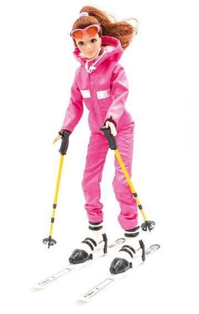 A doll dressed in a pink ski suit, wearing ski goggles, holding ski poles, and standing on skis.