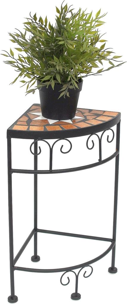 A potted plant sits on a corner plant stand.