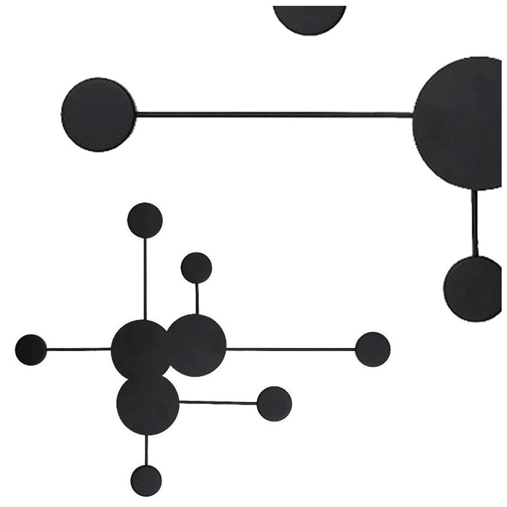 Abstract geometric wall art with black circles and lines on a white background.
