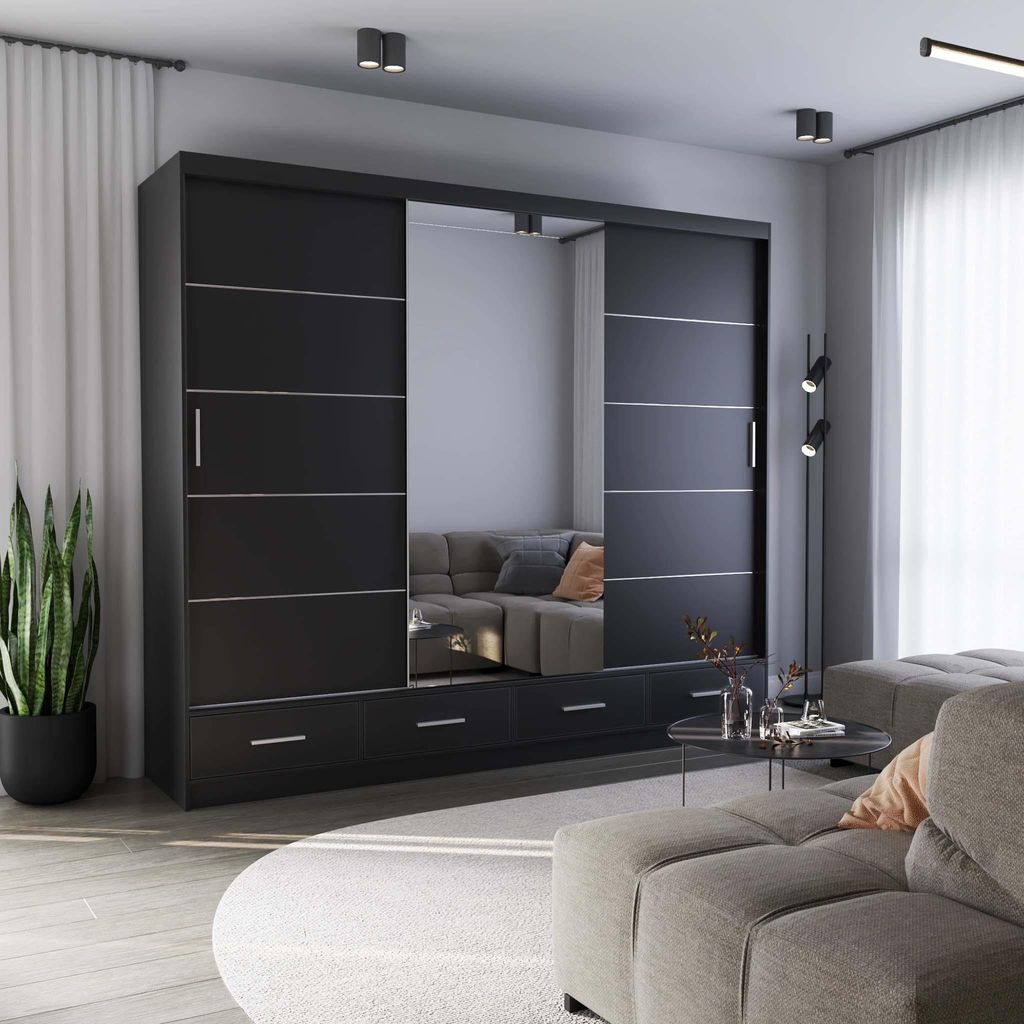 A modern living room with a large mirrored wardrobe and a sectional sofa.