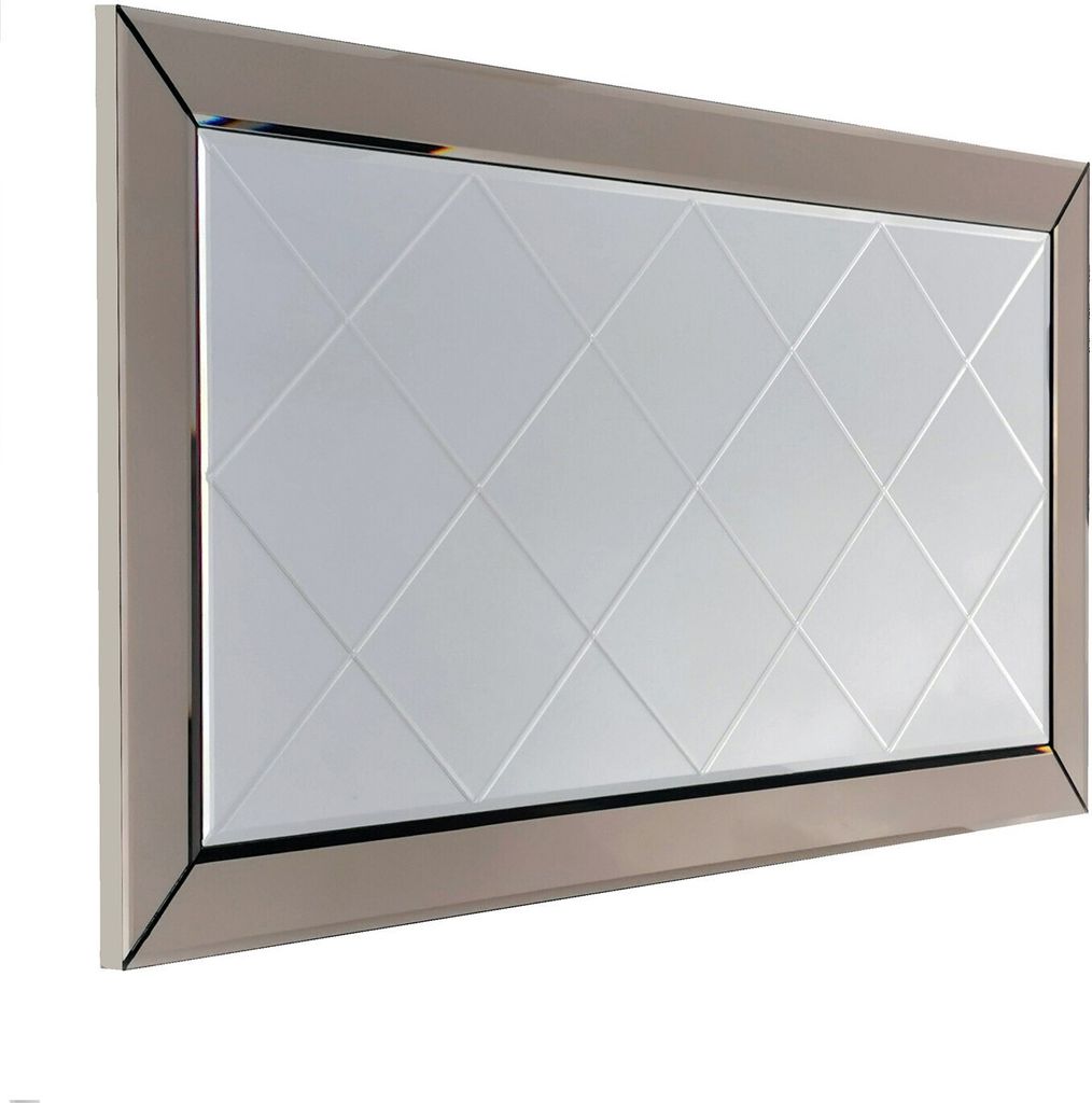 A rectangular mirror with a silver frame and a diamond-patterned glass surface.