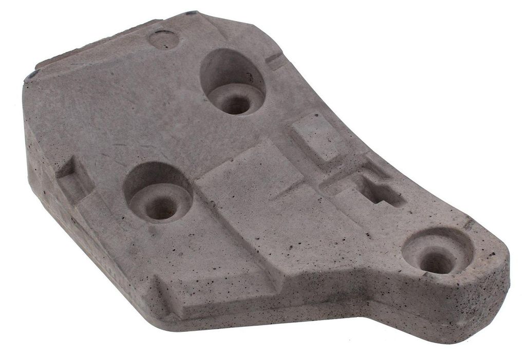 A single gray washing machine counterweight is shown against a white background.