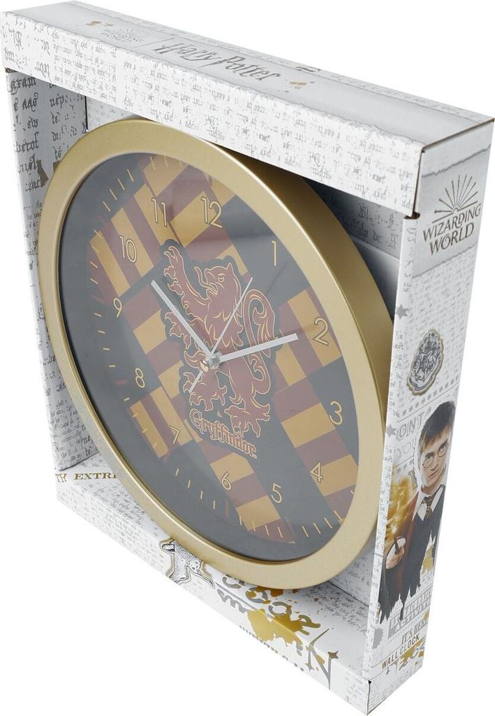 A Harry Potter Gryffindor clock in its packaging.
