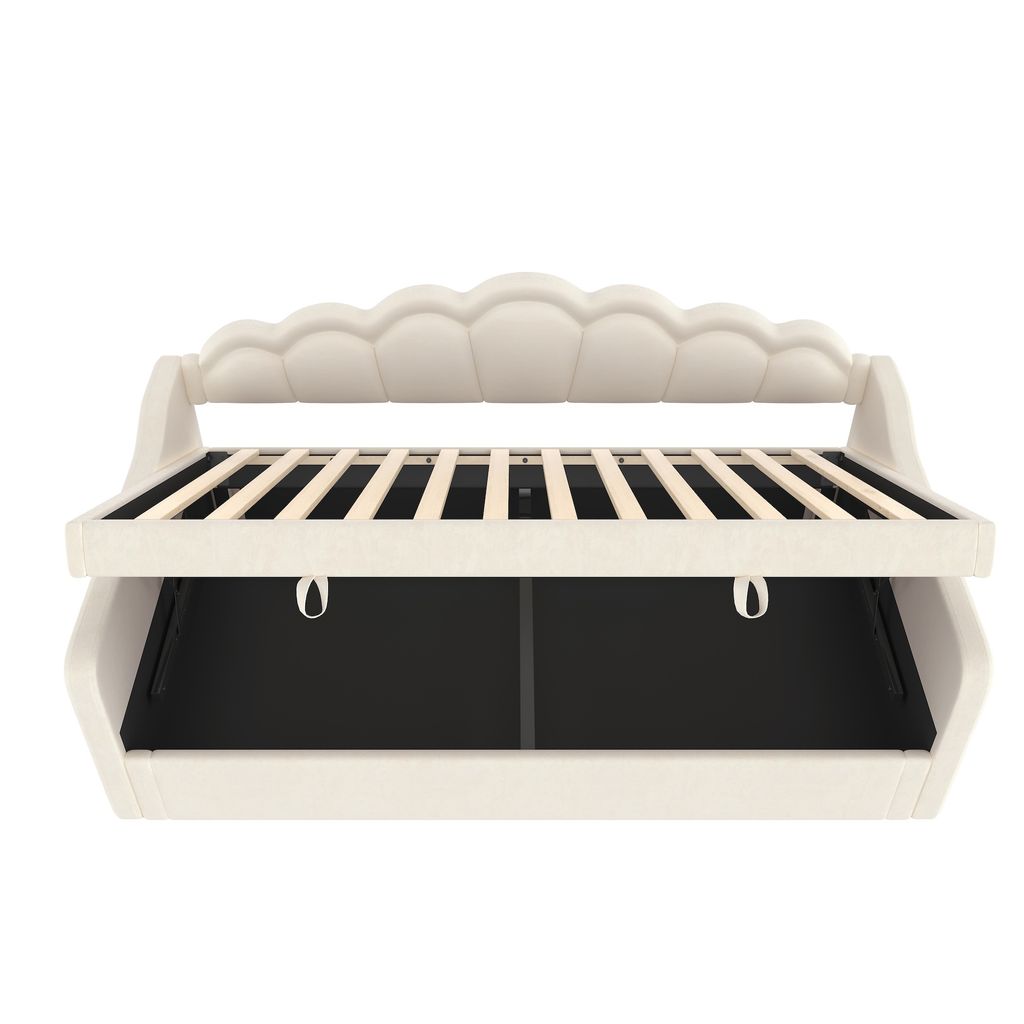 A cream-colored sofa bed with its mattress support slats visible.
