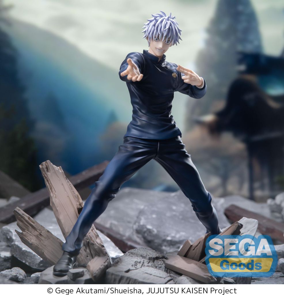 A figurine of Satoru Gojo from Jujutsu Kaisen standing on a pile of debris with a blurred background of traditional Japanese architecture and mountains.