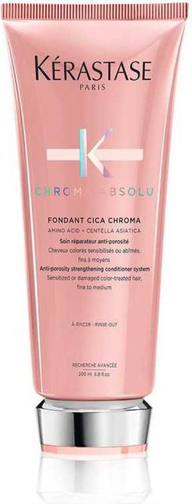 A product shot of a pink conditioner bottle with a silver cap.