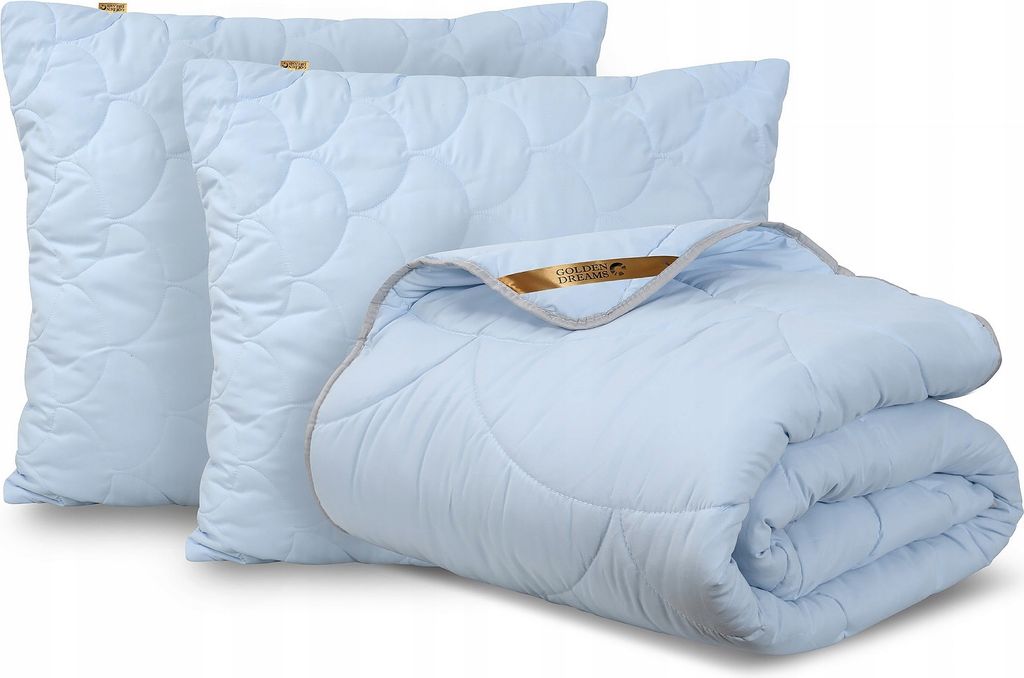 A set of light blue bedding, including two pillows and a folded comforter, is displayed against a white background.