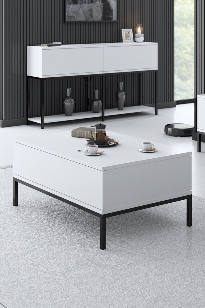 A modern living room setting with a white coffee table and a white console table against a dark ribbed wall.
