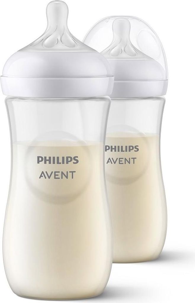 Two Philips AVENT baby bottles filled with milk, shown against a white background.