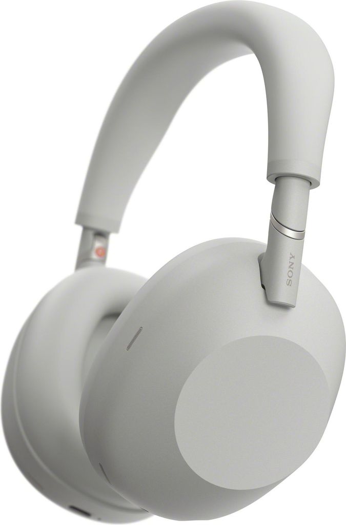 A close-up studio shot of a pair of silver Sony headphones.