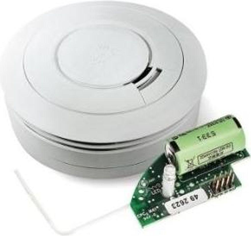 A smoke detector and its internal components are shown on a white background.