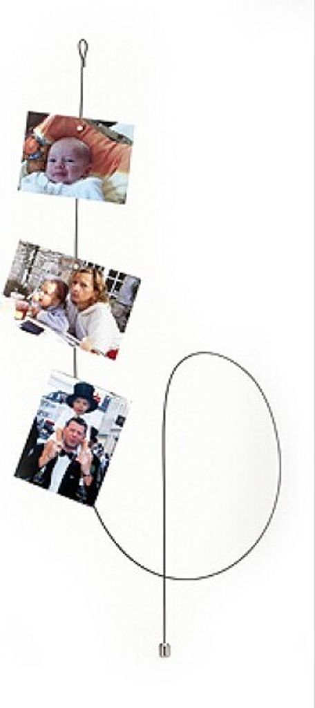 A photo display wire with three photos attached.