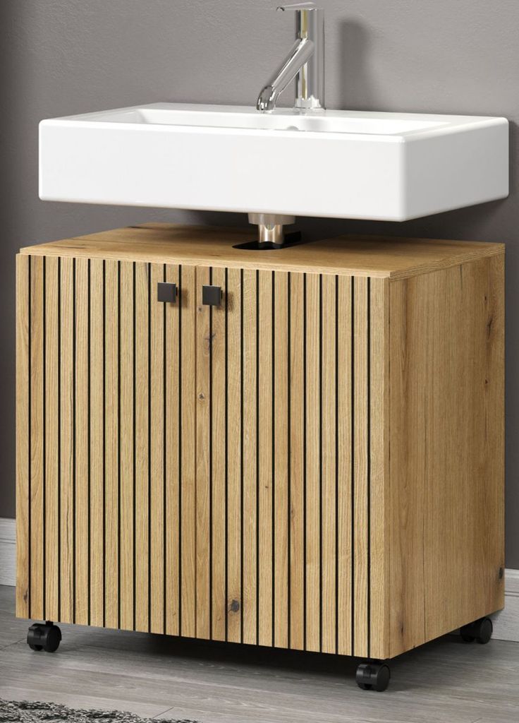 A bathroom vanity with a sink and faucet.