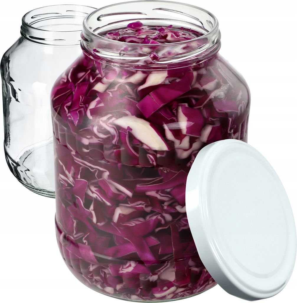 Two glass jars, one filled with chopped red cabbage and the other empty, with a white lid placed next to the filled jar.