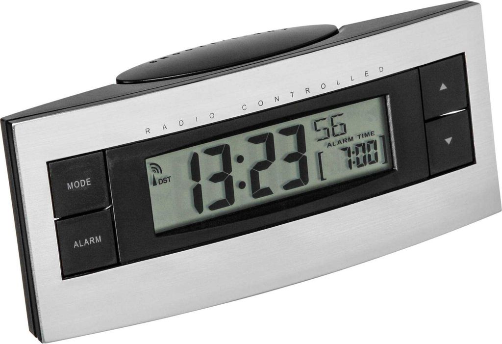 A digital alarm clock with a silver and black casing, displayed at an angle against a light gray background.