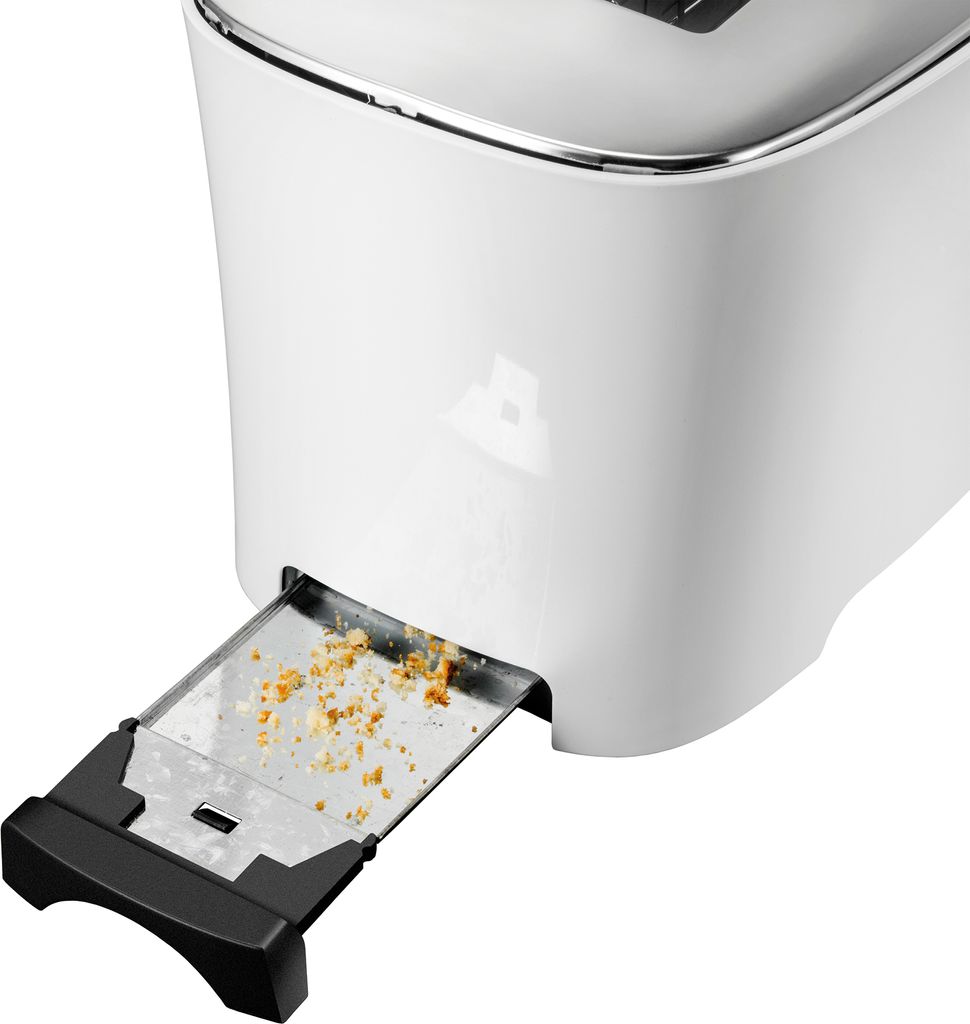 Unold Design Dual: Nahaufnahme mit geöffneter Krümelschublade – Brotkrümel gut sichtbar verteilt.
