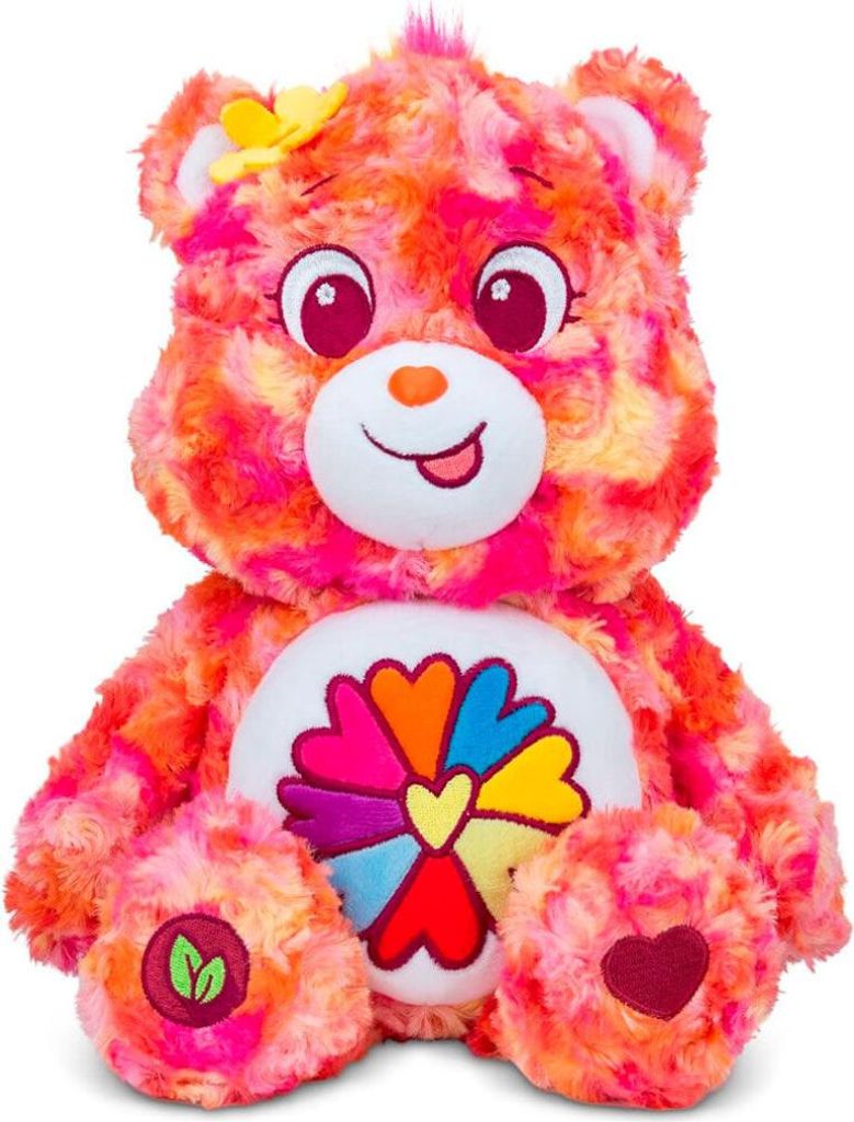 A plush toy bear with a colorful tie-dye pattern and a flower emblem on its chest.
