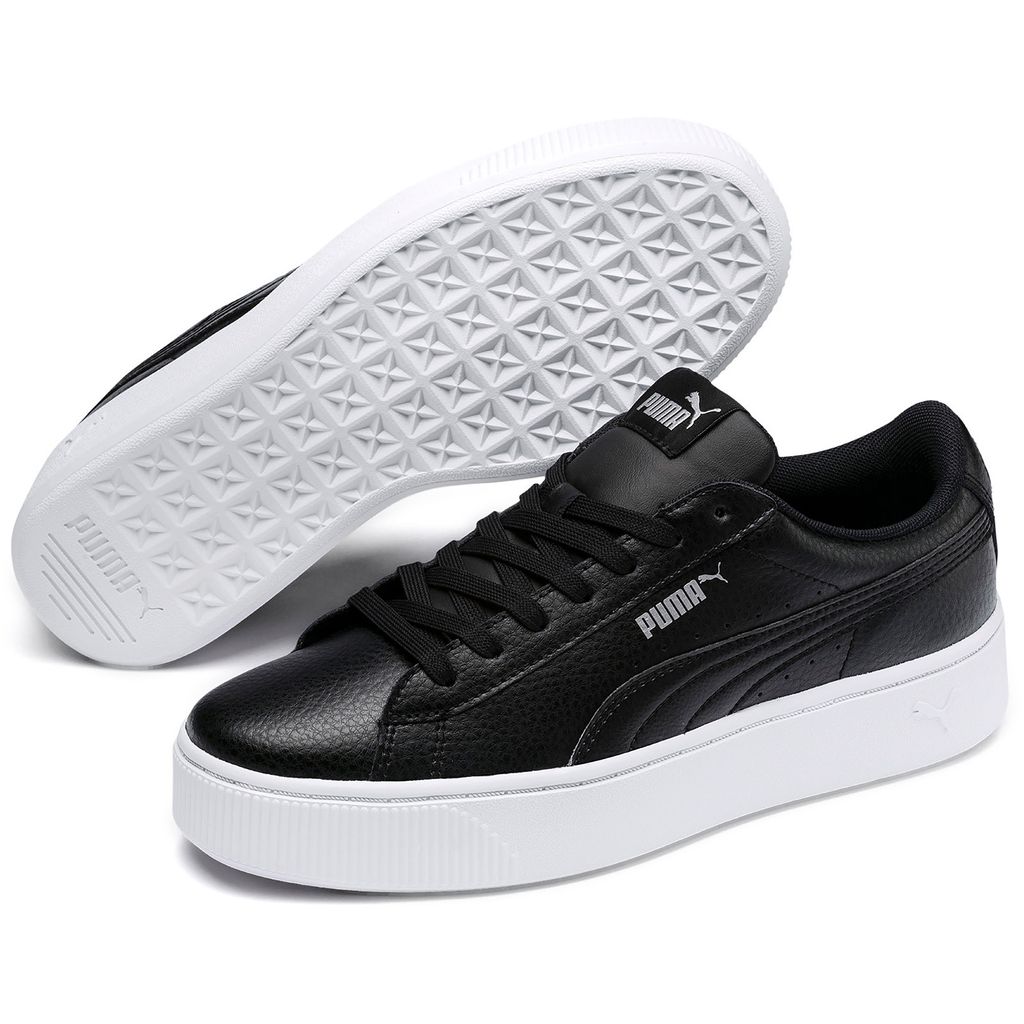 A pair of black Puma Vikky Stacked L sneakers with white soles, shown from a slightly elevated side angle.