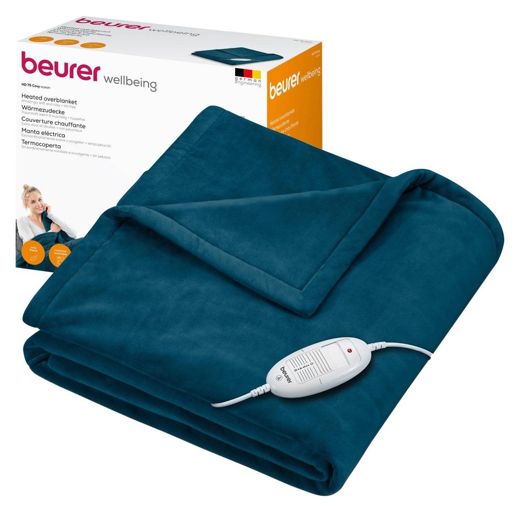 A teal heated blanket is folded and displayed next to its packaging.