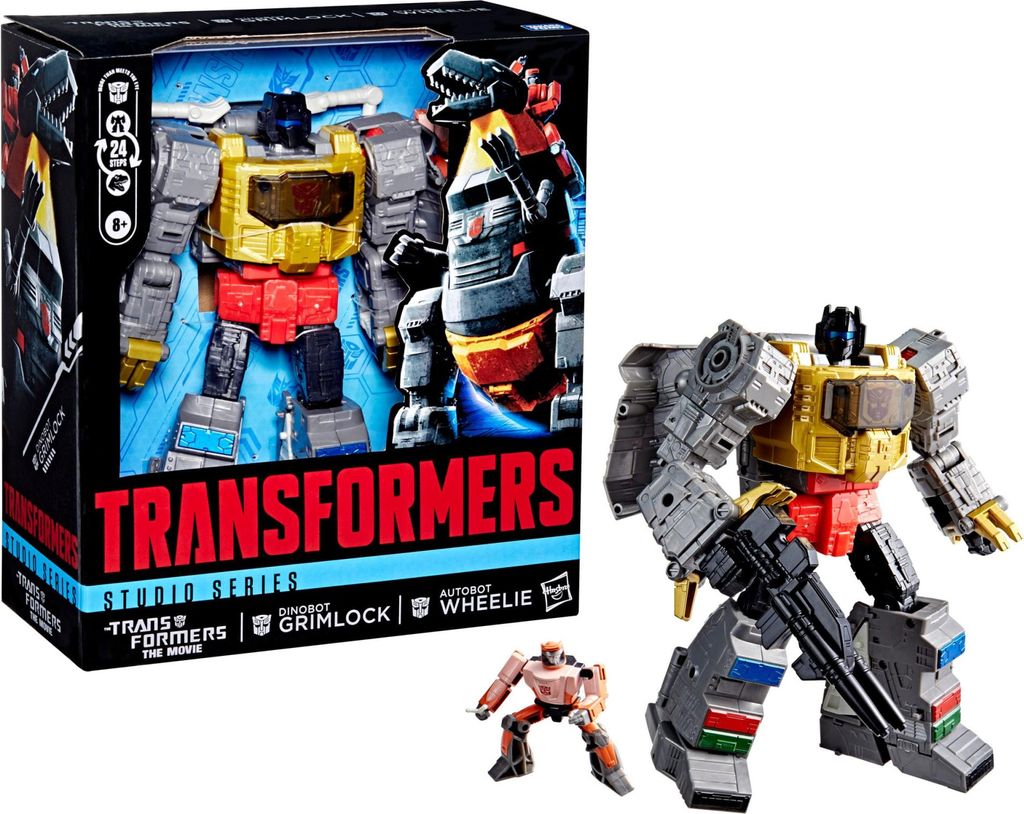 A product shot of a Transformers Studio Series action figure set, including the main Grimlock figure and a smaller Autobot Wheelie figure, displayed next to its packaging.