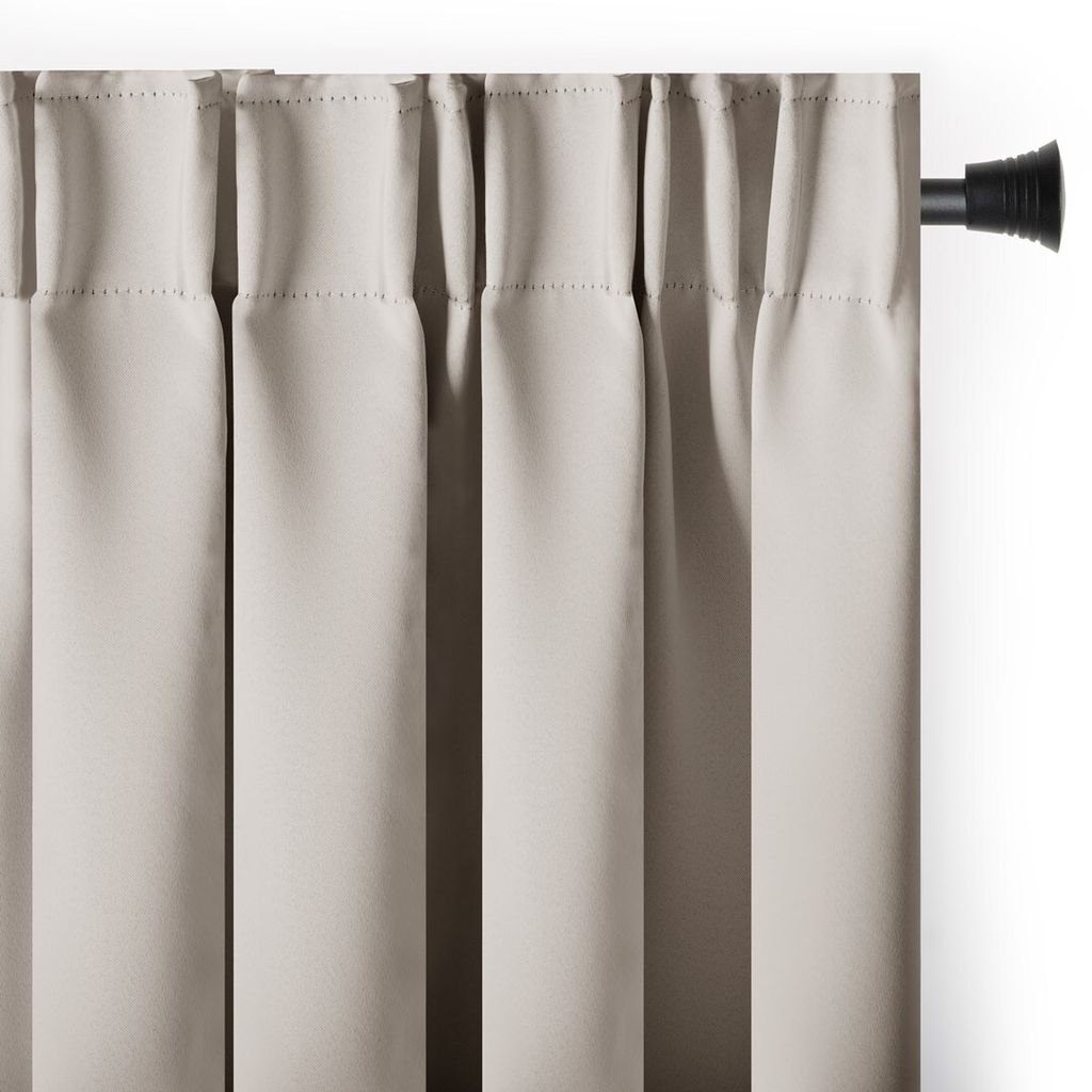 A close-up view of a light beige curtain hanging from a black curtain rod.