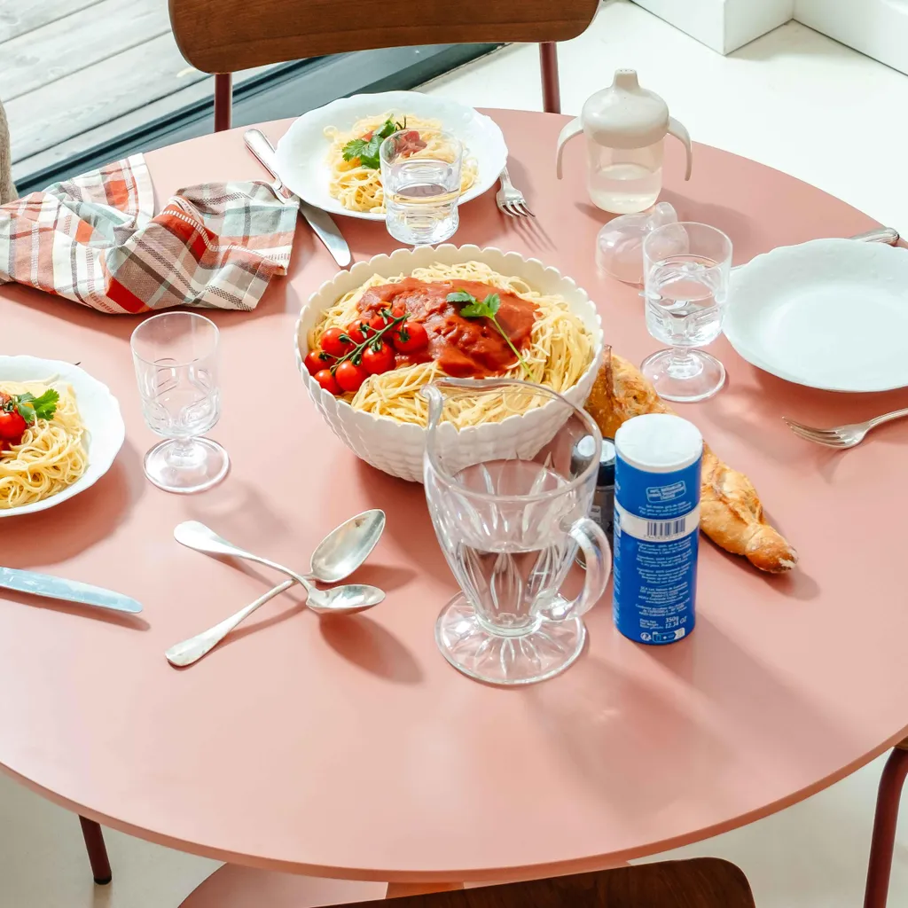 Table ronde 100 cm rose saumon Oviala : gagnez de la place avec style
