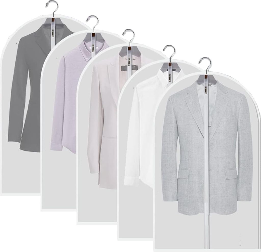 Multiple suits and jackets hanging in protective garment bags.