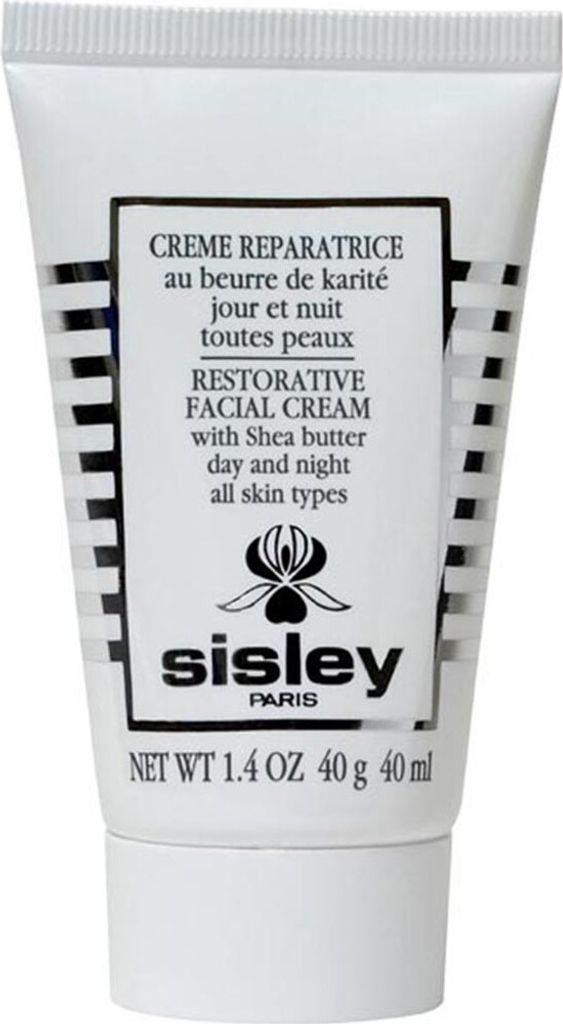 A white tube of Sisley Restorative Facial Cream with black and white striped detailing.