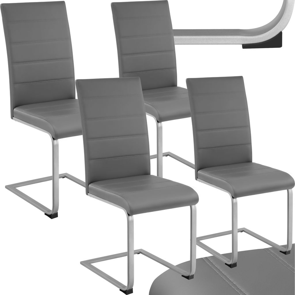Four gray dining chairs are arranged in a studio setting against a white background.