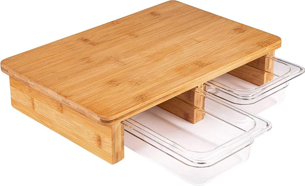 A bamboo cutting board with two clear plastic collection trays underneath.